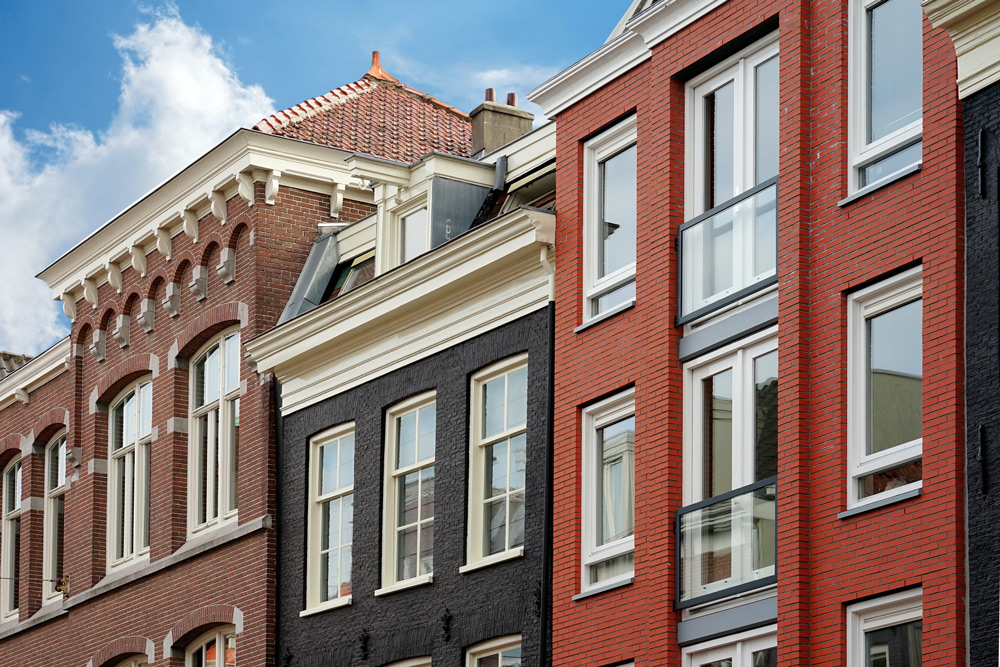 brown, black, and red brick buildings business insurance