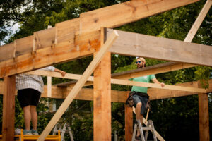 contractors working on building home foundation lumber